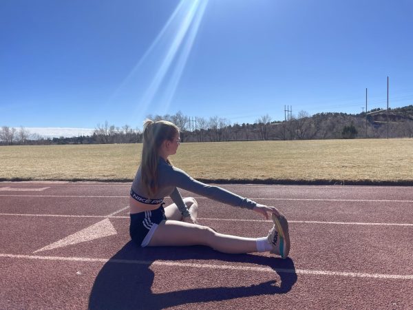 Mackinzy Wall (11) warms up on the track. Track and Field season started on Monday, Feb. 24. "I excited to be spending time with the team every Saturday," Wall said.