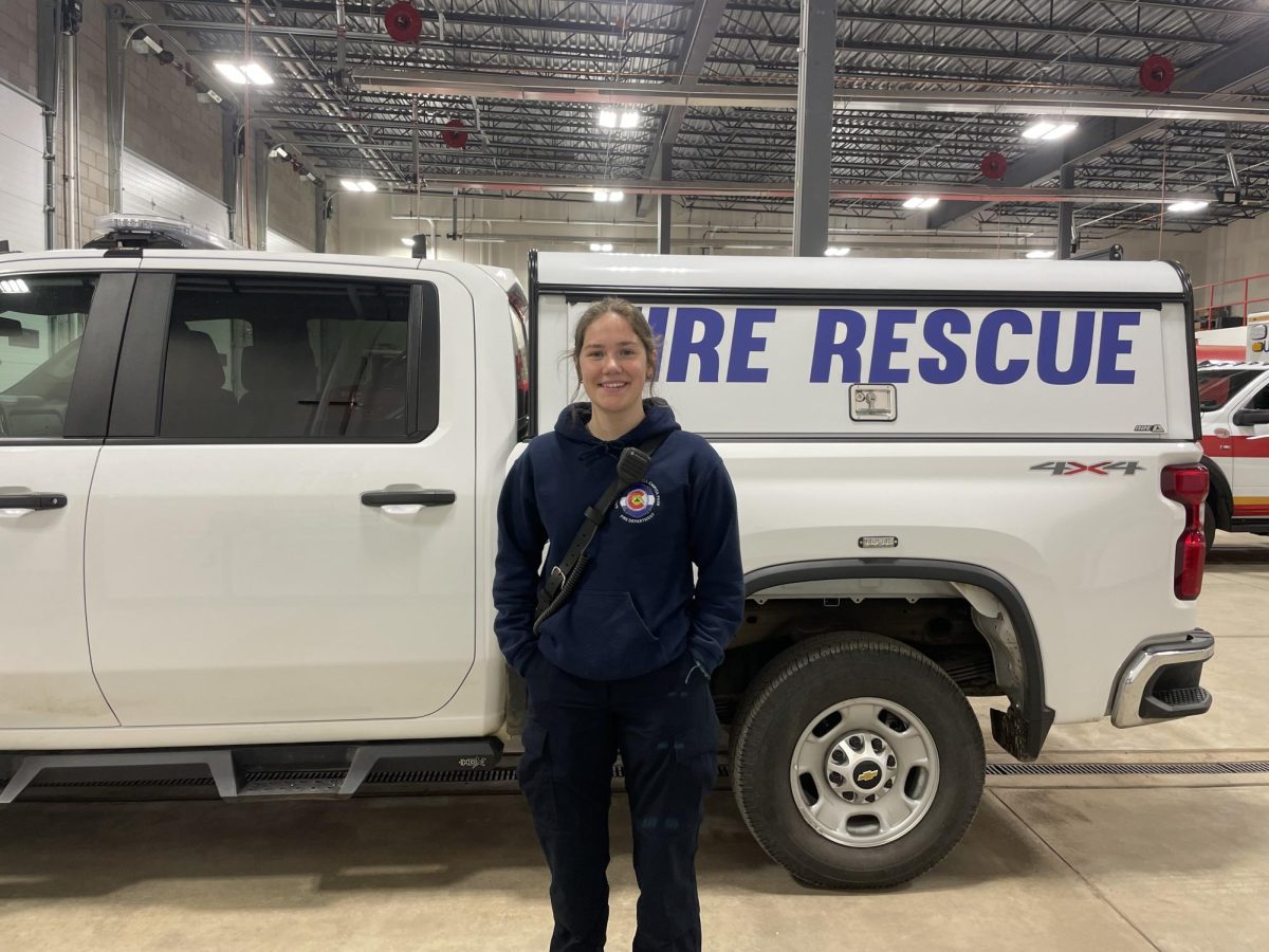 Halli Leonhardt (12) stands by a fire rescue truck before training.