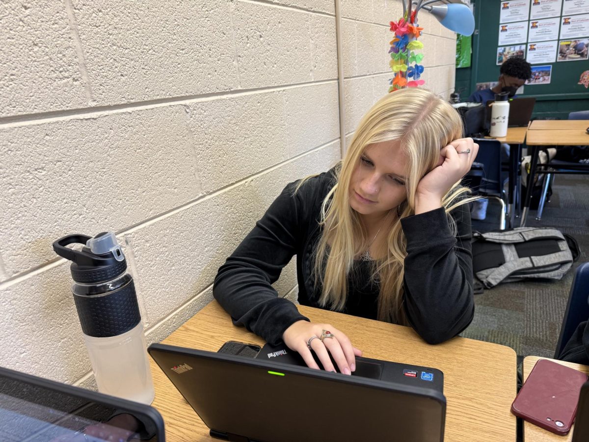 Paige Haugen (11) struggles to work on her computer because the websites she needs to use won't load.