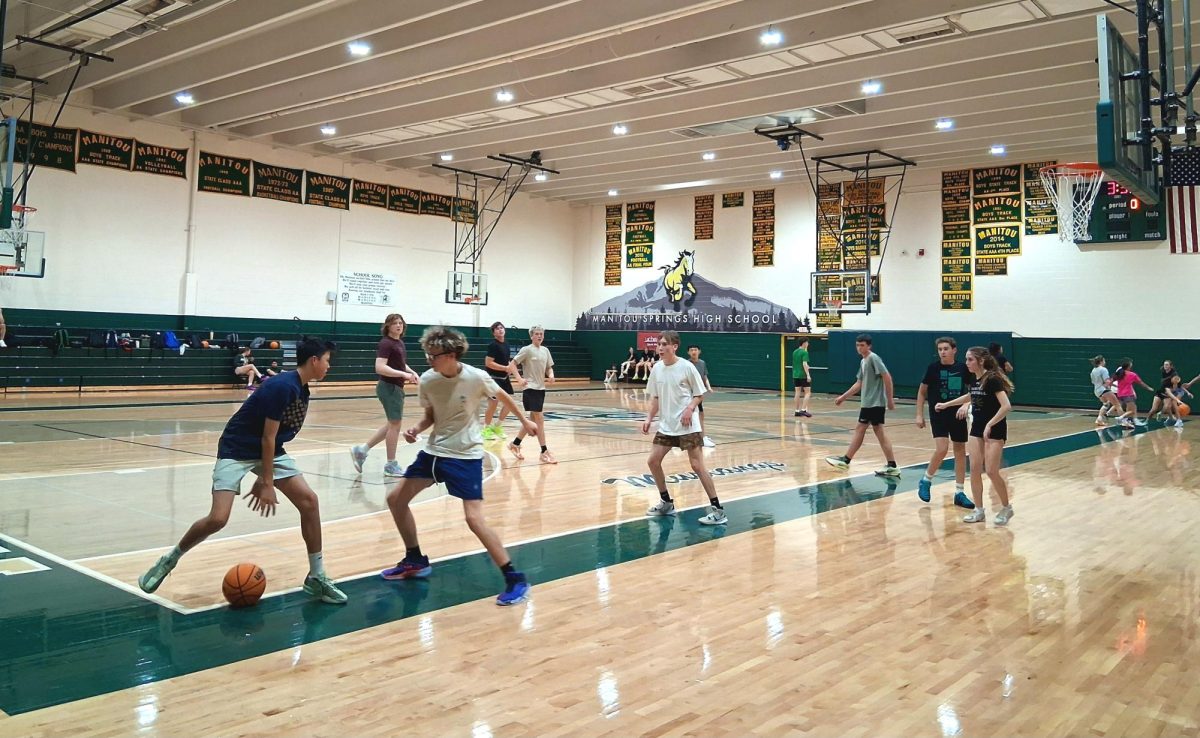 Players play scrimmages at a weekly shoot around in preparation for the upcoming basketball season and tryouts on November 17.