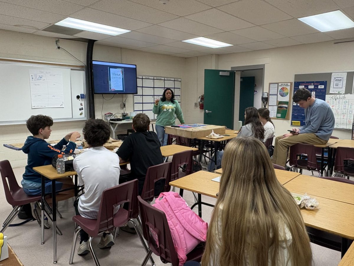 Manitou Springs High School's Spanish Club meets at lunch to talk about selling their Christmas cards and pulseras at the craft fair. Spanish Club is excited to sell these things at the fair for the first time. 