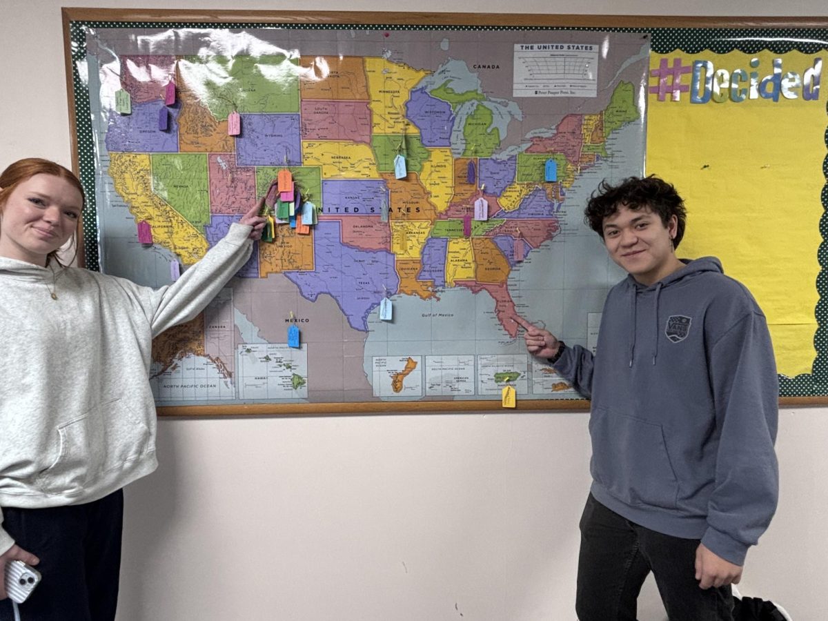 On Dec.12 Isaac Boczkiewicz points to Florida as he is going to Florida tech and Delaney Loper points to Colorado as she is going to UCCS.