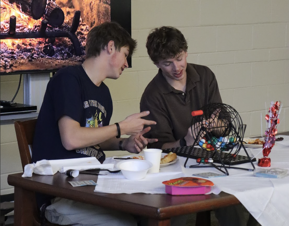 Logan Kelley (12) and Weston Cassidy (12) announce bingo numbers and the Key Clubs Valentine's Lunch on Feb. 12. 