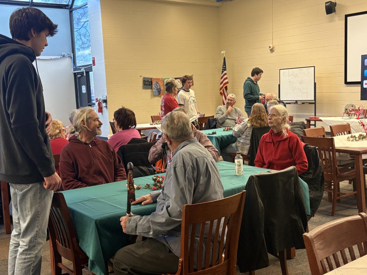 Key Club member, Sebastian Steger (11), took the drink orders for the senior citizens. The MSHS Key Club hosts a Valentine’s Day luncheon for senior citizens on Feb. 12,  in the Media Center.