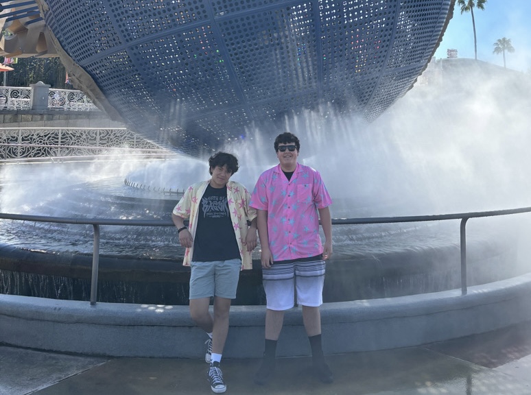 Isaac Boczkiewicz (12) and Liam Owens (12) stand in front of the Universal Studios Globe in Florida. This trip inspired Owens to take another trip to Florida in the summer of 2026.