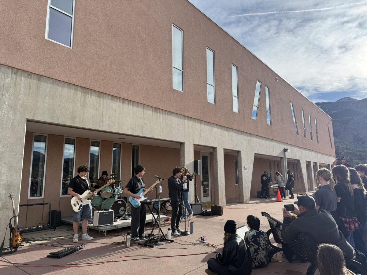 Students Nick Jeffcot (10), Ben Parham (12), Caden Juarez (10), Aj Maestas (10) and Isaac Boczkiewicz (12) perform in their band Can I Call You Later at the Stampede Week tailgate on March 13.