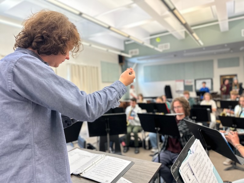 Becket Wendell-Evans directs a song in Dave Williams's class on March 17.