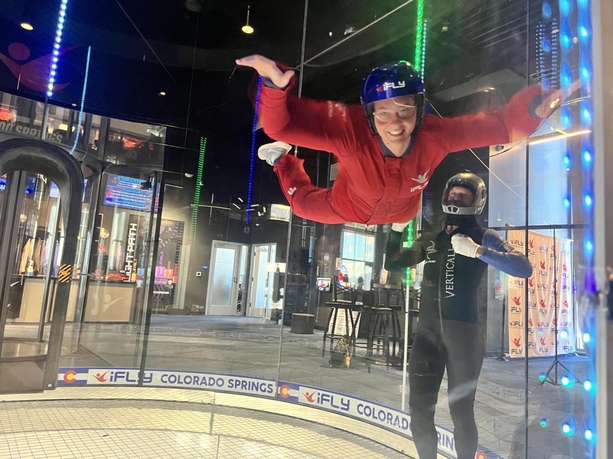 Aleia McBride (12) flys in the tube at iFLY on April 3 with the help of her flight instructor, Andy Honigbaum. Each student flew twice in the tube, once in the lower half of the tube and once in the top half for a "high fly" experience.