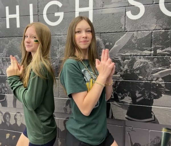 (1) Saige Drotar (9) and Lexi Hammel (9) dress up for Green and Gold Day on Wednesday, May 13 at Manitou Springs High School. After they signed their yearbooks, they went to Kona Ice to enjoy different flavors of shaved ice and outdoor activities. "I really enjoyed going to the shaved ice trucks and being able to participate in all of the outdoor activities because it was so warm out," Drotar said.